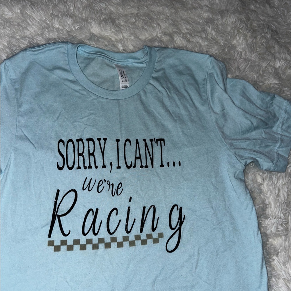Sorry I can’t we’re racing shirt